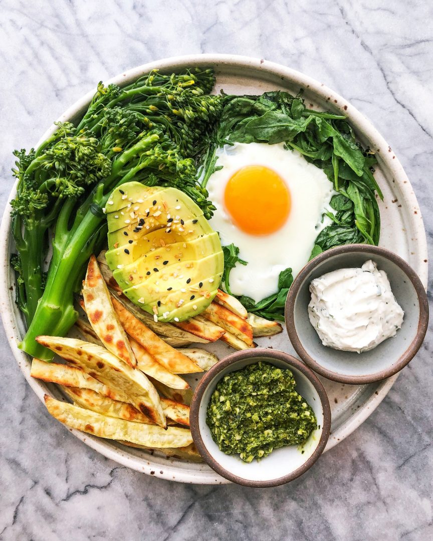 sweet potato fries with fried egg and baby broccoli and avocado